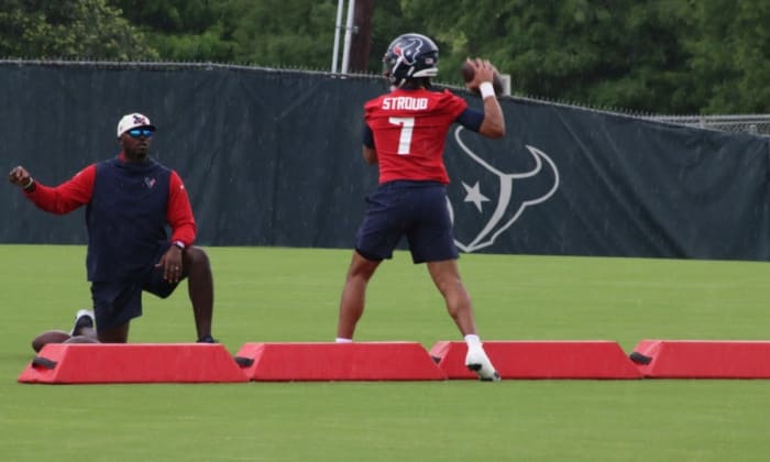 Houston Texans coach Jerrod Johnson (left) instructs quarterback C.J. Stroud (7) during practice. CREDIT: Texans Wire - USA TODAY